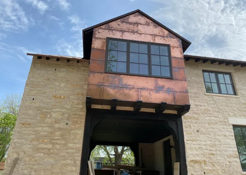 Copper metal panel facade on a stone building for Metal Roof Coating in Twin Lakes